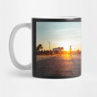 Silhouette of Boy Leading Cattle Across Road at Sunset in Burmese Countryside Mug